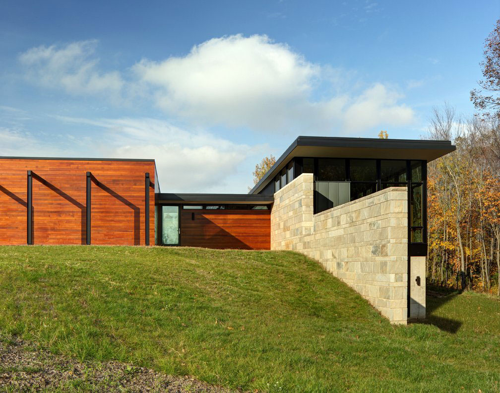Fieldstone House with contemporary home with large yard and green grass