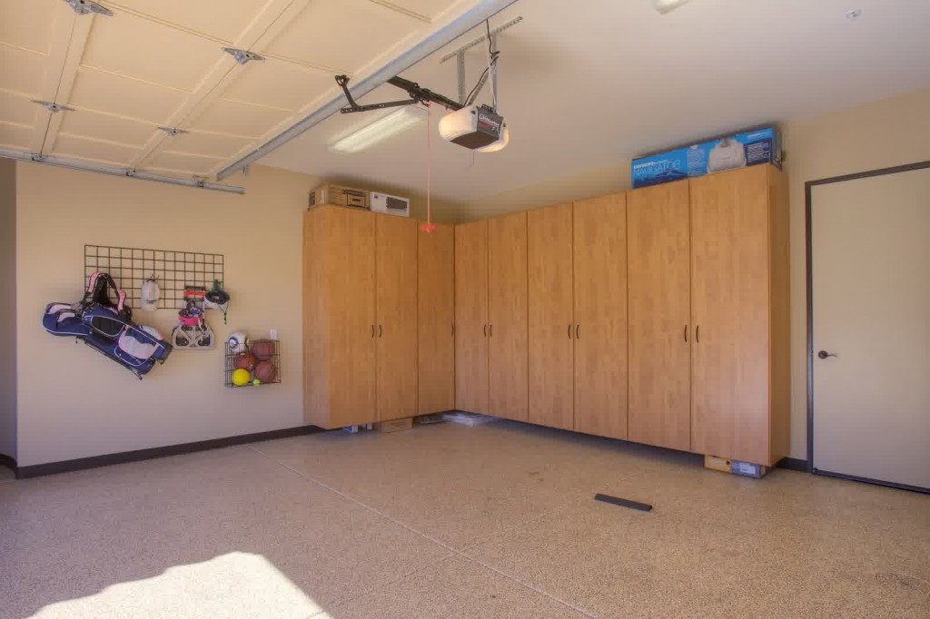 garage conversion ideas with wooden cabinet storage for playroom
